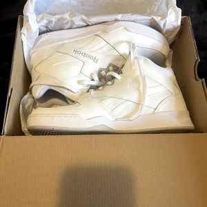 All white Reebok Mid tops